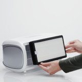 White | Filter held next to white Homedics TotalClean Desktop Air Purifier