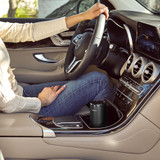 Black | Man sits in car with the Homedics TotalClean 4-IN-1 UV Portable Air Purifier in black in cup holder