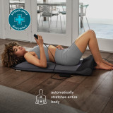 Woman laying on the Homedics Body Flex Back Stretching Mat with Heat