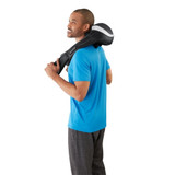 Standing man receives shoulder massage from the Homedics "Thumbs up" Cordless 3D Kneading Massager with Soothing Heat