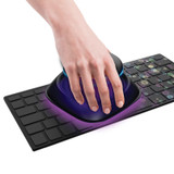 Hand waves UV-Clean Portable Sanitizer Wand over keyboard
