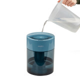 Blue | Water being poured into the top of the Homedics TotalComfort UV-C Ultrasonic Humidifier
