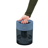 Blue | Customer grabbing handle of the Homedics TotalComfort UV-C Ultrasonic Humidifier