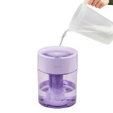 Lilac | Water being poured into the top of the Homedics TotalComfort UV-C Ultrasonic Humidifier